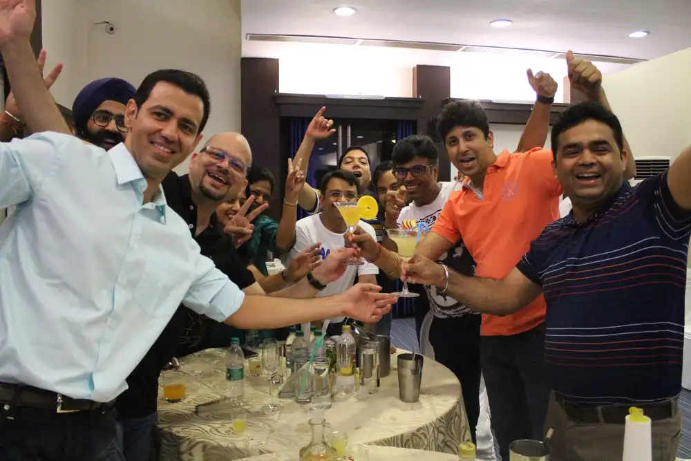 Participants learning mixology skills in a creative team development activity